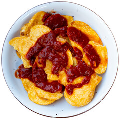 Fried golden brown potatoes with red hot piparras sauce. Isolated over white background