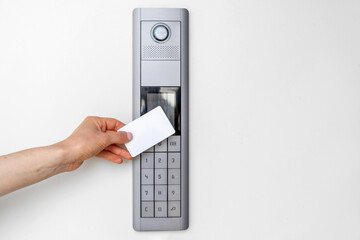 Person using access card to open front door