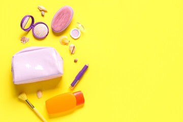 Beautiful composition with cosmetic bag, decorative cosmetics and sunscreen on yellow background