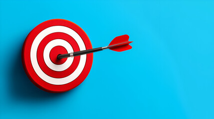 A sharp red dart piercing the center of a white and red target on a vibrant blue background, symbolizing success and achievement.