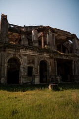 Fototapeta premium Abandoned historic building with overgrown grass in Concepcion, Chile