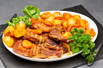 Juicy pork steak on the bone with roasted vegetables, perfect for a hearty meal
