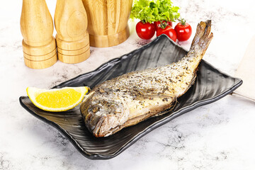Baked Dorado fish served lemon