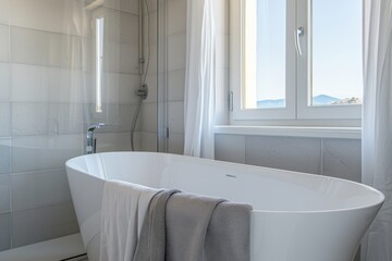 The bathtub is installed in a tropical Asian hotel interior with a sea view. The bathroom is white and clean with comfortable furniture.