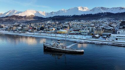 Fototapeta premium Saint Christopher Boat At Ushuaia In Tierra Del Fuego Argentina. Saint Christopher Boat. Ship Sculpture. Downtown Cityscape. Saint Christopher Boat At Ushuaia In Tierra Del Fuego Argentina.