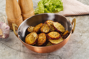 Baked red batat slices with herbs
