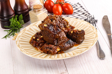 Prepared tasty beef ribs with sauce
