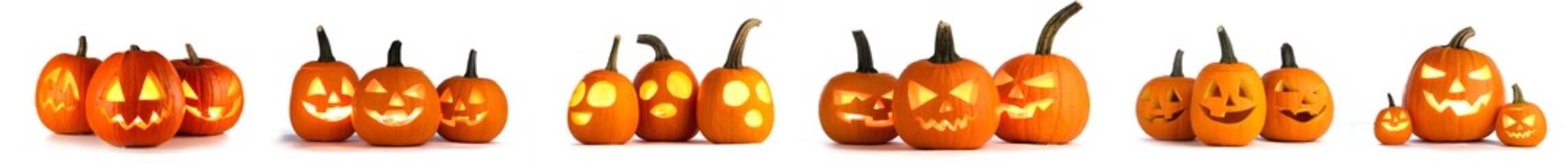 many halloween pumpkins with candles on a white background