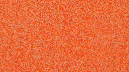 Fototapeta premium A seamless texture of slightly textured apricot orange color paper, showcasing a mid-level granularity that mimics the look of colored construction paper