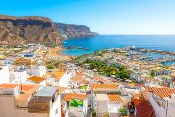Panoramic view from the Mirador observation deck of the whitewashed village, sandy beach, blue sea...