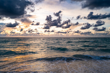 Obraz premium Colorful dramatic sky. Big cloud above ocean. Cloud sky with sea background. Amazing dramatic sky sunset background.