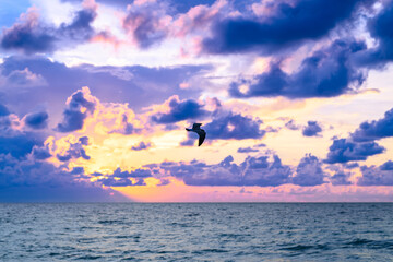 Naklejka premium Dramatic sky. Scenic seascape at sea. Sunset seascape with dramatic sky and colorful clouds. Sky over sea water landscape.