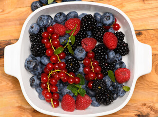 Mix of berries. Berries fruits background. Mix of garden berries. Wild berries in bowl.