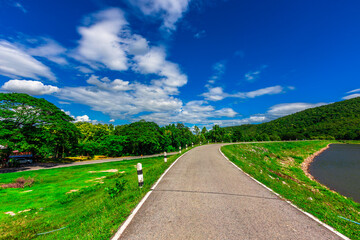 Nature Wallpaper (Mountains, Green Fields, Roadside Accommodation, Twilight Sky) The beauty of nature while traveling, with the wind blowing through the blurred leaves.