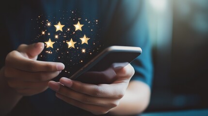 A person is holding a cell phone with a star rating app on it