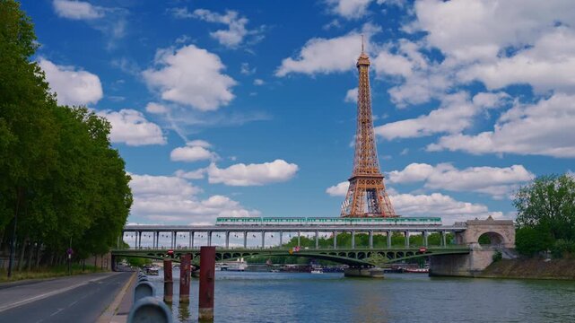 Establishing shot of Paris, France. Landmark iron tower in background. View of the Eiffel Tower from one of the streets of Paris. Parisian architecture of houses in the center of the capital