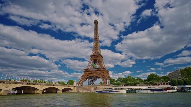 Eiffel tower decorated with Olympic rings for the Olympic games 2024. The Olympic rings installed on the Eiffel Tower with tourists strolling near the Trocadero square Paris, France July 30, 2024
