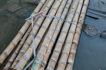 Bamboo Rafting on water. Sustainable nature material background. Transportation, Travel holiday vacation or fishing.