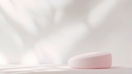 Soft and Minimalist Product Display: A simple yet elegant backdrop with a soft pink podium and delicate light filtering through the background. Perfect for showcasing beauty products, cosmetics.