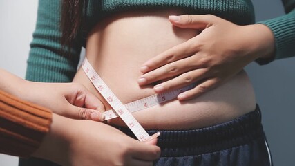 fat woman, fat belly, chubby, obese woman hand holding excessive belly fat with measure tape, woman diet lifestyle concept