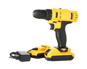 Modern cordless electric drill, charger and battery isolated on white