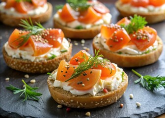 Crunchy bite-sized everything bagel halves topped with indulgent smoked salmon, a dollop of creamy cheese, and fresh dill, perfect for a luxurious appetizer or snack.