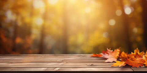 Wooden table with orange leaves autumn background