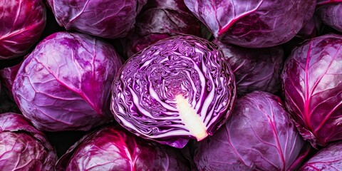 Obraz premium A vibrant stack of fresh purple cabbages, ideal for salads, slaws, and stunning culinary presentations