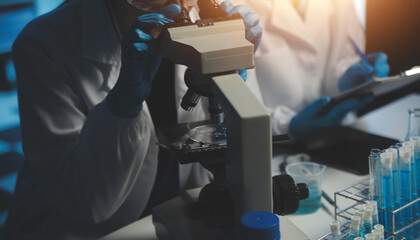 professional chemist woman laboratory using scientific microscope for science research, chemistry scientist with microbiology medicals equipment technology to working with medicine biology experiment