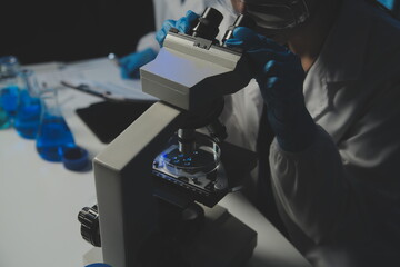professional chemist woman laboratory using scientific microscope for science research, chemistry scientist with microbiology medicals equipment technology to working with medicine biology experiment