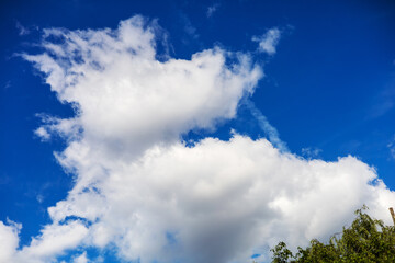 Bright Blue Sky with Fluffy Clouds