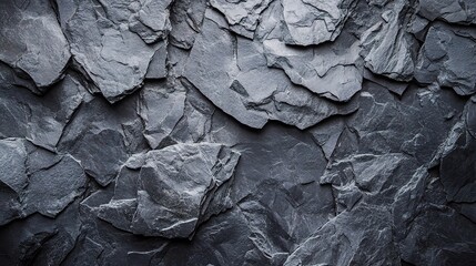 Dark Slate Texture: A close-up, capturing the rough, uneven surface of dark gray slate, ideal for backgrounds and textures. 