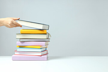 A stack of books on a light background