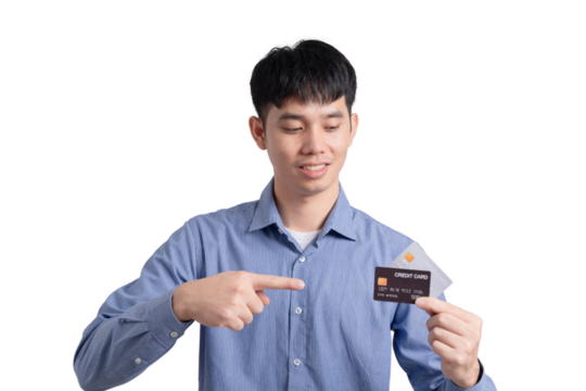 A man is holding a credit card and pointing to it