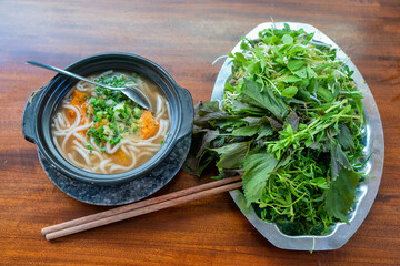 Snakehead fish noodle soup (banh canh ca loc) - with noodles made from rice flour - a delicious and popular dish in many localities in Central and Southern Vietnam