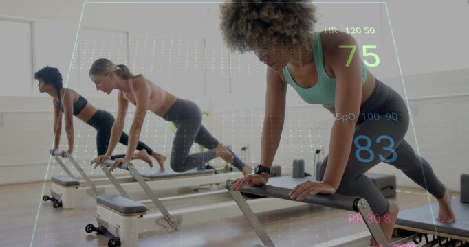 Heart rate and fitness data animation over women exercising on reformer machines