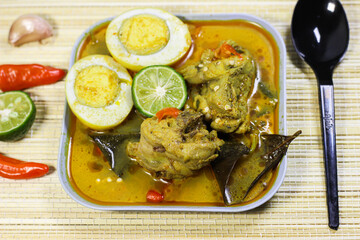 Chicken and eggs with yellow sauce