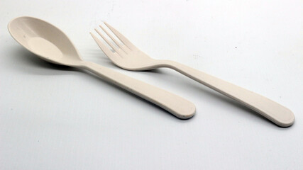 White plastic spoon and fork isolated