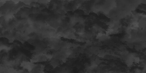 Abstract black watercolor background texture of chaotically mixing puffs of grey smoke on a dark background, beautiful abstract grey cloud on dark black background and colorful texture pattern.