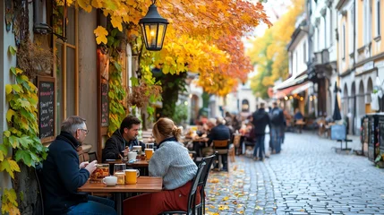 Fleecedeken met foto Charming autumn street with outdoor dining, colorful leaves, and cozy cafes creating a warm, inviting atmosphere. autumn scene concept. © TEERAWAT