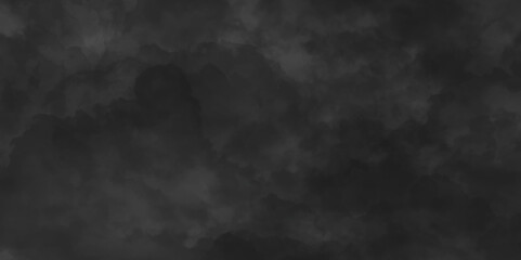 Abstract black watercolor background texture of chaotically mixing puffs of grey smoke on a dark background, beautiful abstract grey cloud on dark black background and colorful texture pattern.