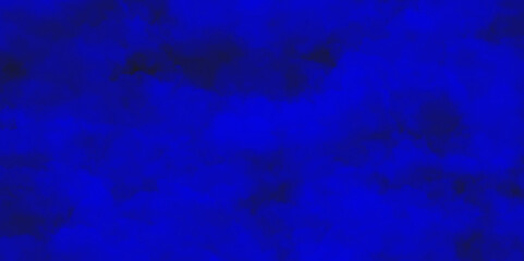 Abstract blue watercolor background texture of chaotically mixing puffs of blue smoke on a dark background, beautiful abstract blue cloud on dark black background and colorful texture pattern.