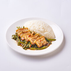 Delicious Thai Stir-Fried Tofu with Vegetables and Steamed Rice on a White Plate - Authentic Asian Cuisine