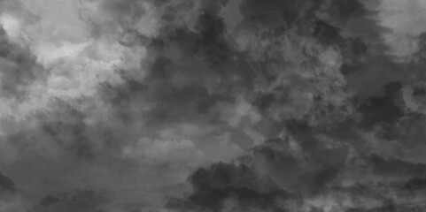 Fluffy stormy clouds in black and white mode storm thunder and tumble across the sky over beautiful natural white clouds, abstract dramatic sky before a storm of gray color black cloud smoke. 