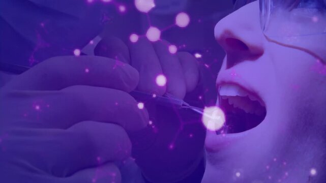 Dental examination animation showing molecular structure with glowing particles