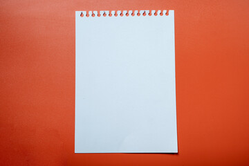 A white sheet of paper with a red background