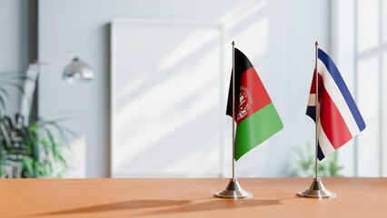 FLAGS OF AFGHANISTAN AND COSTA RICA ON TABLE