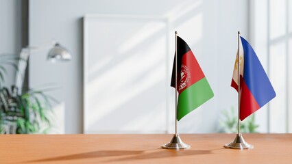 FLAGS OF AFGHANISTAN AND PHILIPPINES ON TABLE