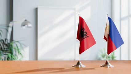 FLAGS OF ALBANIA AND PHILIPPINES ON TABLE