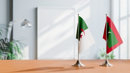 FLAGS OF ALGERIA AND MALDIVES ON TABLE